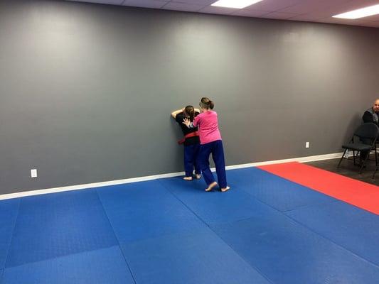 kids class...  practicing "bully" pinning you against the wall...