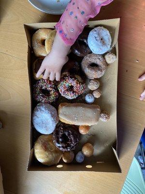 One dozen donuts to be consumed between three adults and two 4 year olds