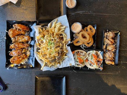 Korean Chicken Wings, Beef Bulgogi Fries, Taco plate, Calamari, Takoyaki ig/tiktok: @jhennybellyeats