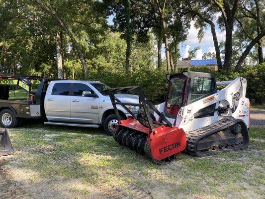 Skid Steer with forestry mulcher attachment