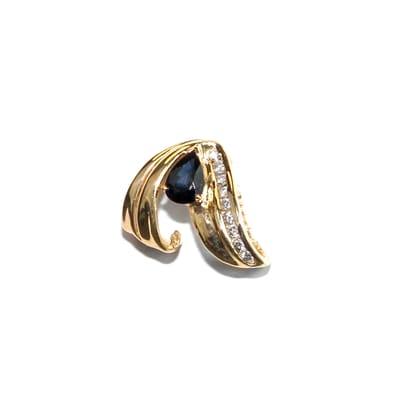 Pear-shaped .80ct. Sapphire gemstone and 9 diamonds (.20 total wt.) nestle in a 14ct. (3.5 grams) yellow gold slide setting.