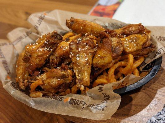 Teriyaki wings on a nest of fries