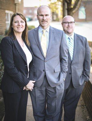 Attorneys Athlea Adkisson, Brandon J. Burton, and Michael P. Hill