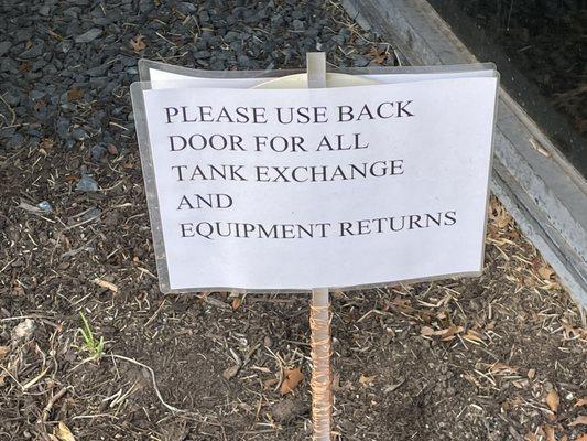 Yes you can drop off those oxygen tanks. This sign is by the door.