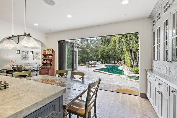 Two AG Millworks Bi-Fold Systems create the ultimate indoor-outdoor entertainment space in this Los Gatos, CA home.