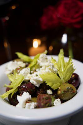 Marinated Olives | Kalamata, casteltvetrano, queen olives, goat cheese, oregano, chili flakes.