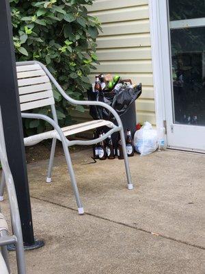 Trash beer bottles next to pool door