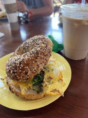 Broccoli egg and cheese on an everything bagel.