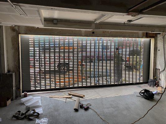 Perforated roll up door for apartment complex