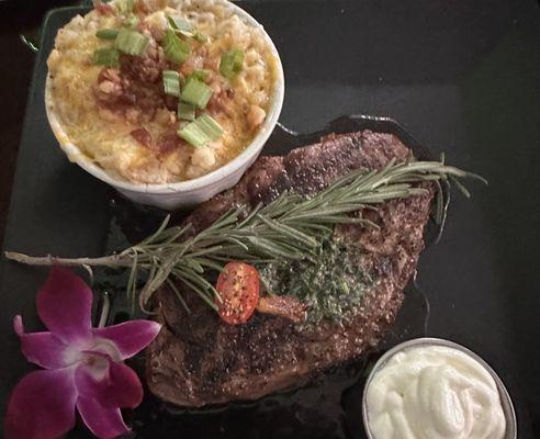 Ribeye, twice baked "loaded" potato (sour cream in the bowl)