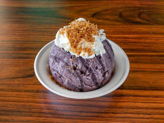 Kailani's Purple Dream with your choice of homemade  Ube or Coconut ice cream, Ube shave ice, topped with whipped cream and toasted coconut.