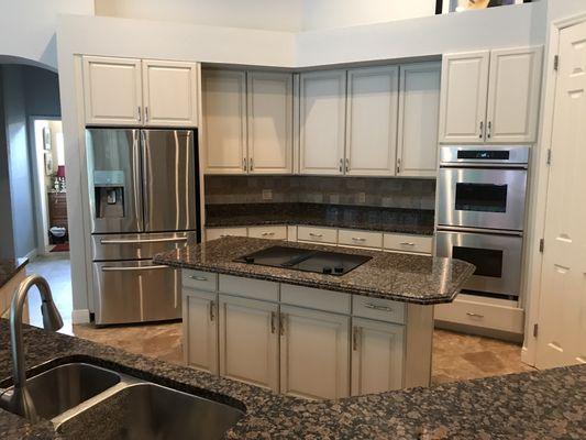 Kitchen we refinished from stain color to off white with light glaze