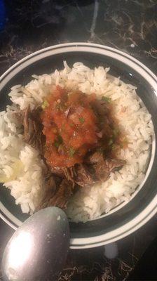 Rice with steak and fried tomatoes, onions and jalapeños