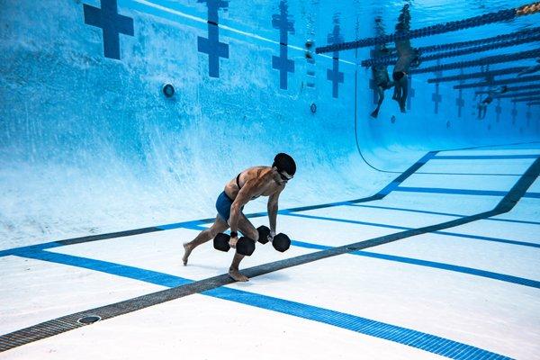 Underwater Dumbbell Walks: Safely push your mental strength and overcome barriers.