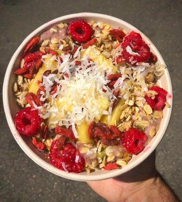 Açaí Bowl BASE: Mango Açaí TOPPINGS: Granola, Pineapple, Raspberries, Goji Berries, Coconut & Honey