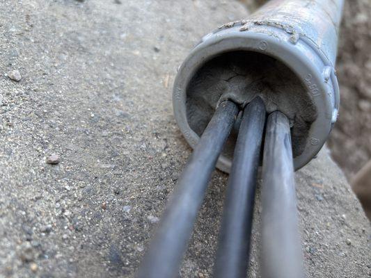 Underground feeders from service point to the manhole. Cables are duck sealed with 3 layers.