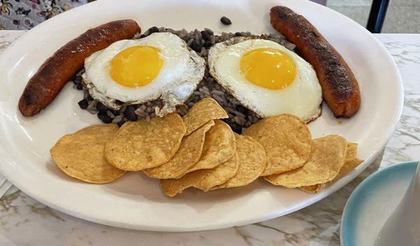 Pinto con chorizo with sunny side up eggs and rice and beans