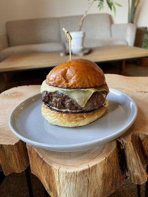 Native Fields Grass Fed Burger made with 8oz Dry aged Beef, Caramelized Onions, Gruyere Cheese, and Russian Dressing