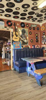 Decorative space at B-Side other room with fun stuff for sale. Old time candies & sodas, t-shirts, guitars & amps new and used records.