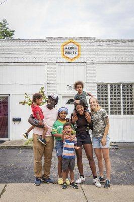 The Akron Honey Family in front of Production Room