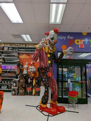 Large clown animatronic at the front entrance of the store