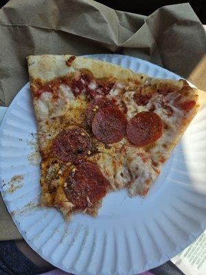 Large slice of pepperoni pizza (sorry I ate half)