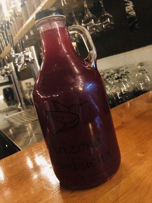 Blueberry ginger kombucha in a to-go growler