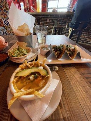 Chicken tortilla soup. Al pastor tacos. Guacamole