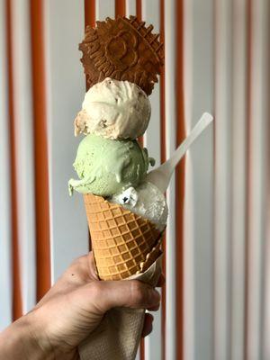 3 scoops in a waffle cone:  biscotti, pistachio, hershey's cookies & cream