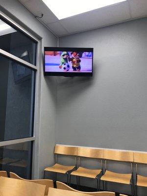 They play Disney movies while you wait in the lobby to get called back to see the Doctor. My nephews didn't even notice the 5min wait time.