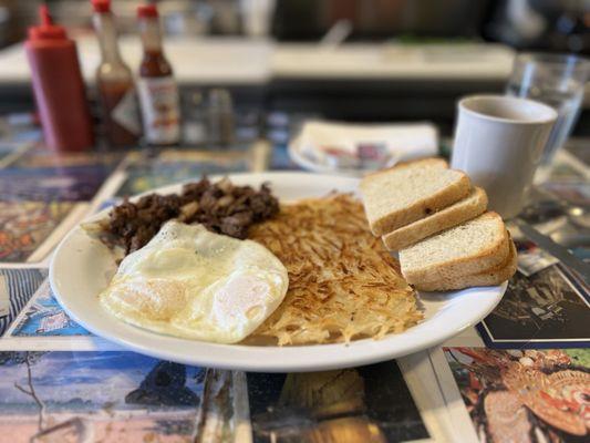 Eggs over easy with Bulgogi, hashbrowns and sourdough bread