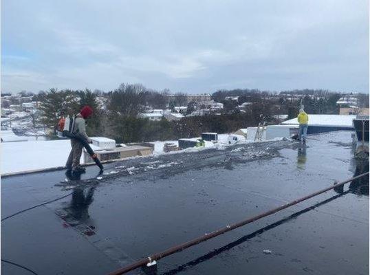 We're taking care of business, even after your commercial roofing system freezes over!