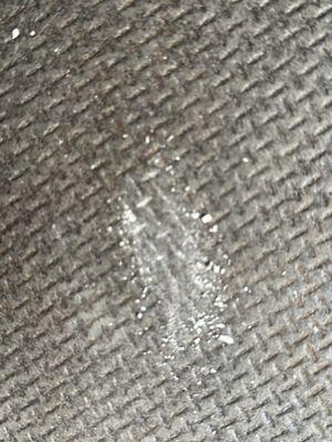 Chalk substance off the bottom of my painting in the van--(artist uses sheetrock mud)