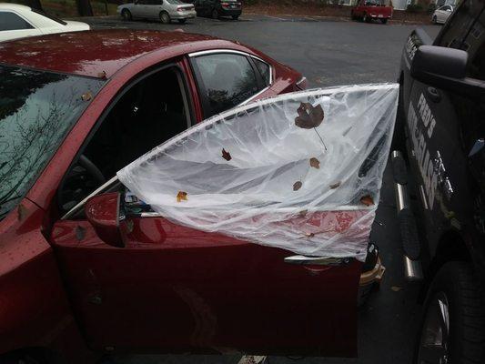 Before picture of a driver door glass on an Altima.