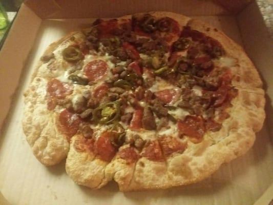 This was a large pan pizza with extra jalapeños.