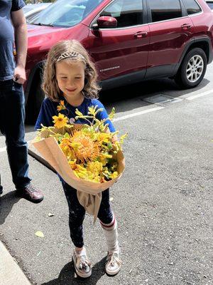 Happy 6 year old with flowers arranged by Pin