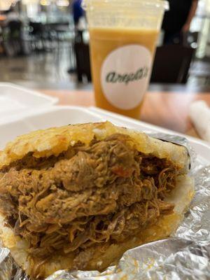 Beef arepa and passion fruit soft drink. Arepa de carne y jugo de maracuya.