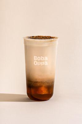 BOnana Cold Brew Latte. Nguyen Coffee combined with organic milk, fresh banana milk foam, and topped off with a brown sugar brulee.