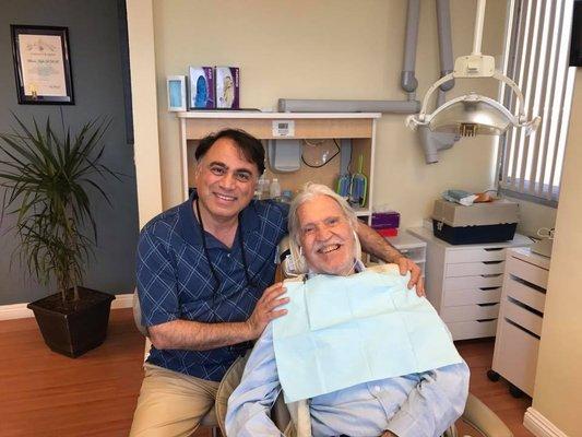 Dr, Bruce Vafa DDS. with his patient, Michael Butler (producer of Hippie milliner NS Hair) at Smile Angel of Beverly Hills. Dental Crown