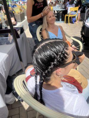 Tight braid on  straight black beautiful hair .