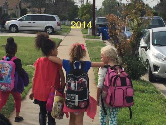 My kids and a friend walking with a teacher from the local Elementary school to Children's Choice for their after school program in 2014!