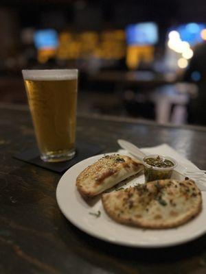 Beef and mushroom empanada and a Ghost Town IPA.