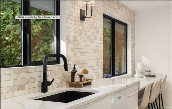 modern kitchen, countertops, black faucet, tile backsplash, cabinets, hardwood floor, undercount sink.