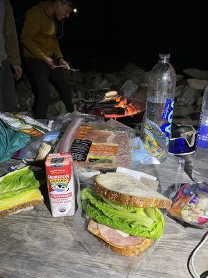 The general store has basic ham/Turkey and cheese sandwiches in the refrigerator; romaine lettuce and basic veggies; and free mayo packets