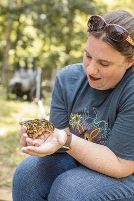 Co-owner/farmer Amy, holding baby Japanese Coturnix Quail chicks.