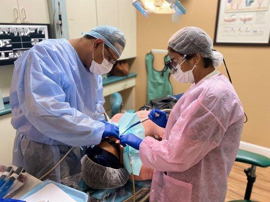 Dr. Jain and Dr. Gupta working together on a pre-op appointment.