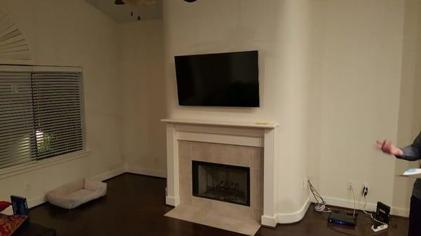 60" tilt mount over fireplace