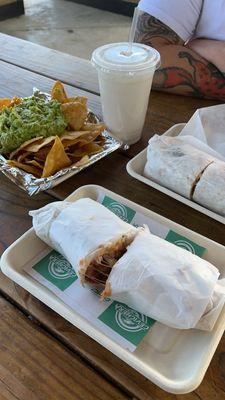 Carne asada burritos with chips and guac