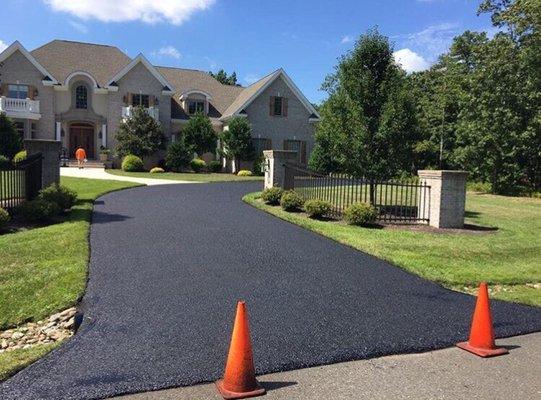 Hot oil based sealant applied to a driveway we paved years ago in McLean