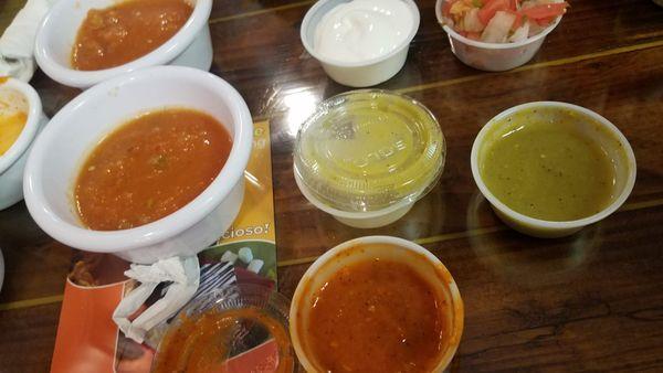 Salsas. Regular in the white container, then tomatillo green and habanero in the plastic. The salsas were just ok tasting.